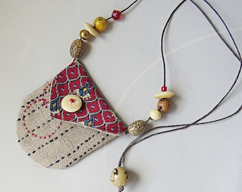 Small artisanmade POSSIBLES bag talisman pouch using silk, linen, bone, beads & a bit of sashiko on a length of waxed inen cording