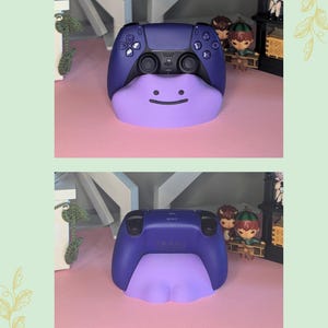 May include: A custom-designed purple and lavender video game controller. The controller has a lavender Ditto-shaped base with a smiling face. The top of the controller is a darker purple. The back of the controller is also visible.