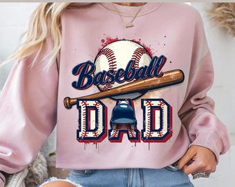 May include: Pink sweatshirt with a baseball, bat, and helmet graphic. The graphic says "Baseball Dad" in a vintage style font.
