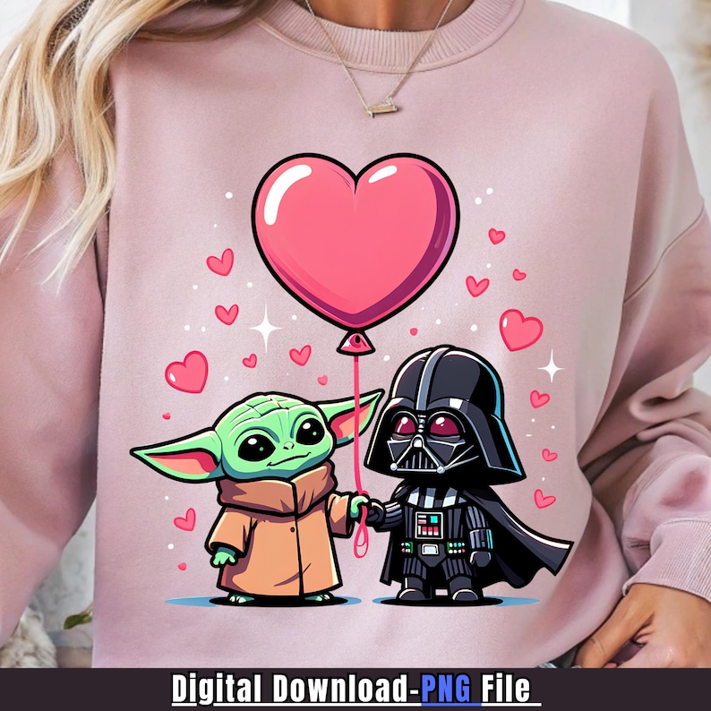 May include: Pink sweatshirt with a cartoon illustration of Grogu and Darth Vader holding hands and a pink heart-shaped balloon. Small pink hearts are scattered around the characters. The text "Digital Download-PNG File" is at the bottom.