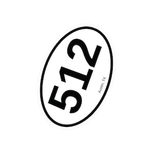May include: White oval sticker with black text that reads "512 Austin, TX".