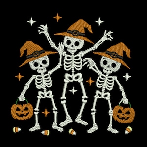 May include: Embroidered Halloween design featuring three skeletons wearing orange witch hats with black buckles. Each skeleton holds a jack-o'-lantern and is surrounded by stars and candy corn on a black background.