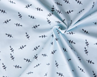 Leaves on light blue knitted fabric in organic cotton. Mint fabric with leaves by half the meter (50cm)