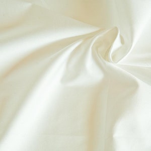 White organic cotton sateen. High thread count 100% Organic Fairtrade Certified Cotton GOTS. Wide width organic sheeting by 1/2 meter.