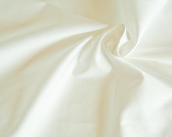 White organic cotton sateen. High thread count Fairtrade Certified Cotton GOTS with optical brightener. Wide width sheeting by 1/2 meter.