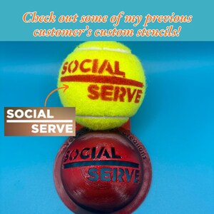 May include: A bright yellow tennis ball featuring the red text SOCIAL SERVE printed on its surface, positioned above a dark red circular stencil tool that also displays the text SOCIAL SERVE in a cutout design, with a blue background.