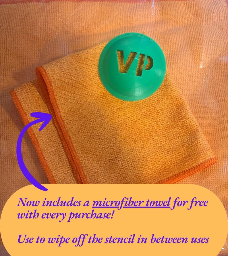 May include: A bright orange microfiber towel with orange stitched edges, paired with a circular green plastic stencil featuring the letters VP cut out from the center. The image includes text stating: Now includes a microfiber towel for free with every purchase! Use to wipe off the stencil in between uses.