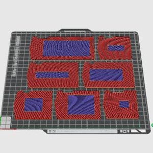 May include: Six red and blue patterned rectangular shapes on a white grid background. The shapes are arranged in two rows of three. The shapes are all different sizes and have a slightly raised edge.