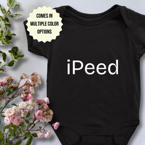 May include: Black baby onesie with white text that reads "iPeed".