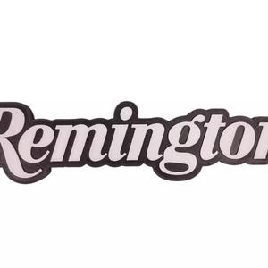 May include: Black and white logo with the word "Remington" in a stylized font.