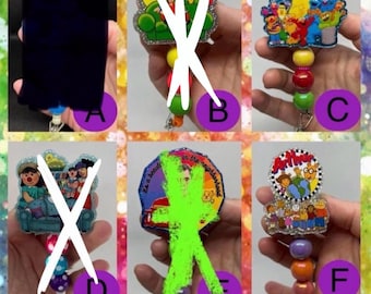 90s baby cartoon badge reels. This listing is for ONE badge reel of your choice.
