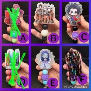 May include: A collection of retractable badge reels featuring various cartoon characters. The reels have different bead colors and designs, including characters from Beetlejuice, Edward Scissorhands, and The Nightmare Before Christmas. The text "YOU CAN'T SIT WITH US" is visible on one reel.