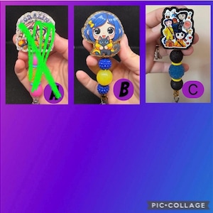 May include: Three badge reels featuring cartoon characters. One reel has a character with blue hair and a black cat, another has a group of characters, and the third has a character with a blue hair. Each reel has a beaded design.