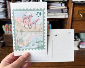 May include: A Kings Canyon postcard with a stamp-like border, featuring a landscape scene with a lake and mountains. The text "Kings Canyon" and "40¢" are visible. The back of the postcard is blank with lines for writing and a space for a stamp.