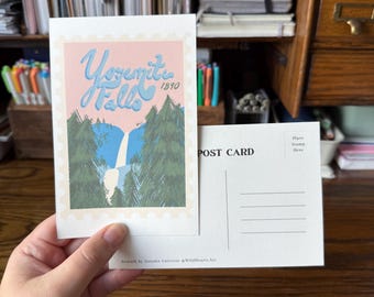 May include: A postcard featuring a stylized illustration of Yosemite Falls. The design includes the text "Yosemite Falls 1890" in a light blue script against a pink background. The postcard's reverse side is blank with lines for addressing and a space for a stamp.
