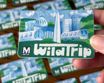 May include: A collection of WildTrip Metro cards. Each card features a watercolor illustration of a city scene with a train, buildings, and a monument. The cards have a green and white color scheme with the Metro logo.