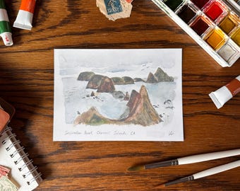 May include: Watercolor painting of Inspiration Point, Channel Islands, CA. The painting depicts a rocky coastline with a view of the ocean and sky. The painting is on a white background.