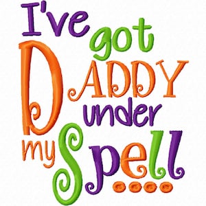 May include: A colorful embroidered design with the text "I've got Daddy under my spell..." in purple, orange, and green lettering.