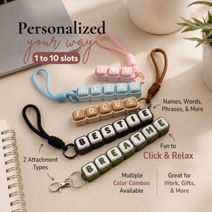 May include: Five customizable keychains with rectangular blocks featuring letters and symbols. The keychains come in pink, light blue, tan, black, and olive green, with either loop or metal clasp attachments. Text includes I heart U, ALEX, FOCUS, BESTIE, and BREATHE.