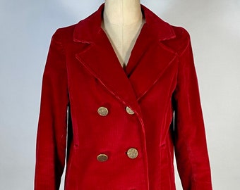 May include: A red corduroy double-breasted jacket with gold buttons.