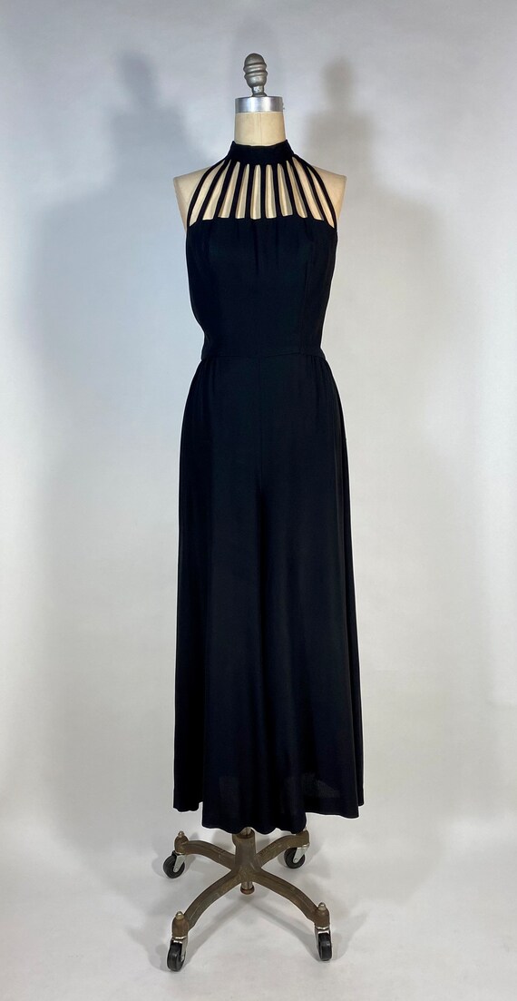 Vintage 1990’s black jumpsuit with cage neckline a