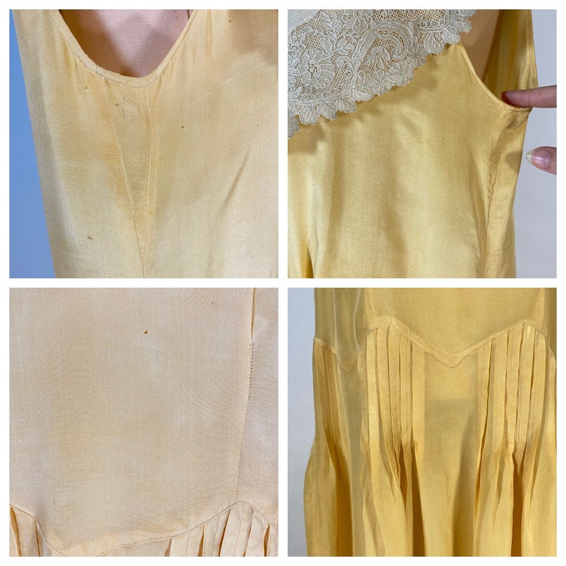 May include: A pale yellow vintage slip dress with a lace trim at the neckline. The dress has a fitted bodice and a flowing skirt with pleats.