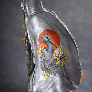 May include: A set of three ceramic vases in varying heights. The vases are white with a textured, ribbed design. The tallest vase is approximately 10 inches tall, the medium vase is 8 inches, and the smallest is 6 inches.