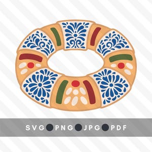Może przedstawiać: Wektorowa ilustracja Rosca de Reyes, tradycyjnego meksykańskiego słodkiego chleba. Chleb jest okrągły z otworem pośrodku, ozdobiony niebieskimi kwiatowymi wzorami, czerwonymi i zielonymi akcentami oraz białymi kropkami. Obraz zawiera opcje typu pliku: SVG, PNG, JPG i PDF.