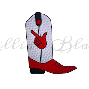 May include: A red and white cowboy boot patch with a red hand gesture. The boot has a white background with a subtle pattern, a red toe, and a black heel. The hand is making a gesture.
