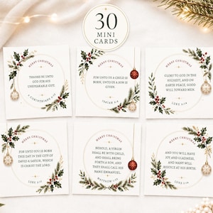 May include: A set of 30 mini cards featuring Christmas themes. Each square card displays a circular frame decorated with holly, berries, and hanging ornaments. The cards contain various religious scripture verses and the text Merry Christmas.