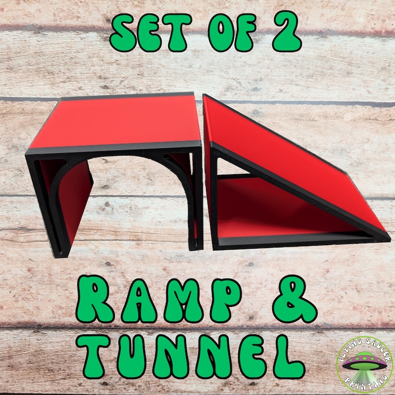 May include: A set of two red and black ramps and tunnels. The text "SET OF 2" and "RAMP & TUNNEL" are in green bubble letters. The Flying Saucer Printing logo is in the bottom right corner.