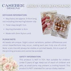 May include: A collection of beaded keychains featuring animal-shaped silicone beads, round wooden beads, and pink or brown silicone beads on 2mm nylon cord. The keychains include gold-toned lobster clasps and keyrings with a 3cm diameter.