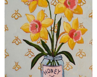May include: An original painting of yellow daffodils with pink centers in a glass jar labeled "HONEY". The jar sits on a blue surface against a light blue background with gold bee patterns. The label also features a bee.