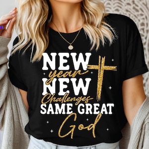 May include: Black t-shirt with the text "NEW year NEW Challenges SAME GREAT God" in white and gold glitter lettering. A gold glitter cross is also featured. The shirt also has SVG, PNG, EPS, and DXF text.