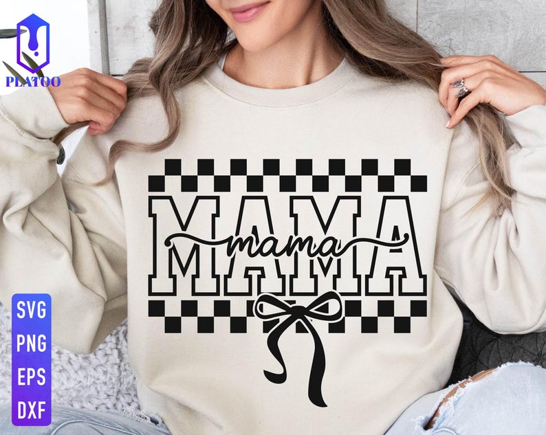 May include: Cream-colored sweatshirt with the word "MAMA" in bold, black, block letters, with a cursive "mama" overlay. The design includes a black and white checkered pattern and a black bow.