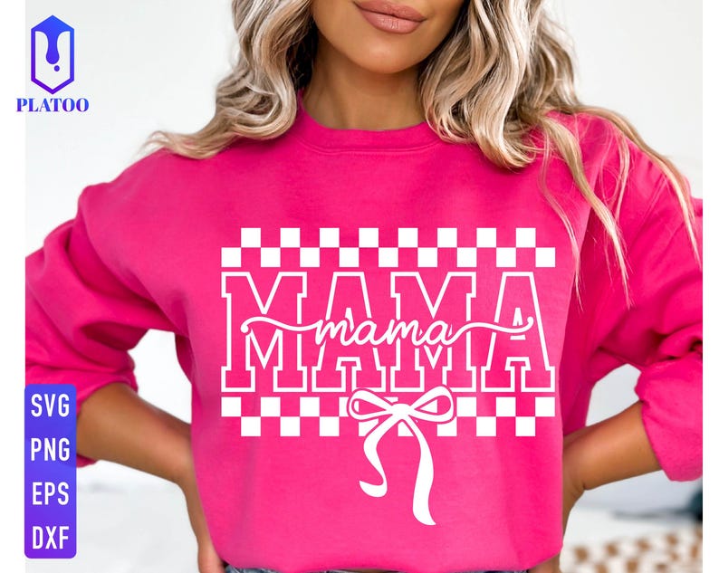 May include: A bright pink sweatshirt with the word "MAMA" in white block letters, with "mama" in cursive script underneath. A white bow is at the bottom. The sweatshirt also has a checkered pattern above the word "MAMA".
