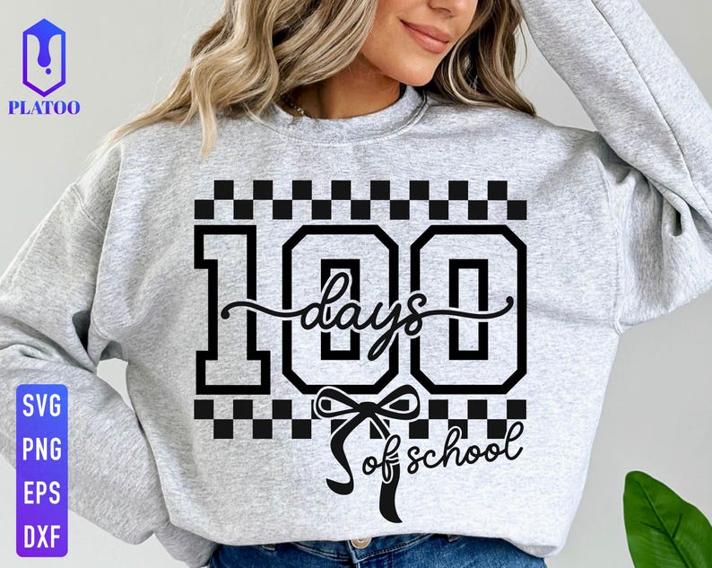May include: A light gray sweatshirt with a black graphic that reads "100 days of school." The design includes the number 100 in a bold font, a cursive "days" and "of school" with a bow. The sweatshirt also has a checkered pattern.