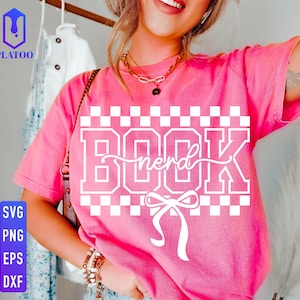 May include: A pink t-shirt with the word "BOOK nerd" in white block letters and a bow graphic. The shirt has a checkerboard pattern above and below the text. The image also includes SVG, PNG, EPS, and DXF file type icons.