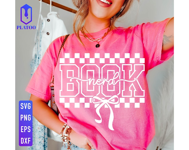May include: A pink t-shirt with the word "BOOK nerd" in white block letters and a bow graphic. The shirt has a checkerboard pattern above and below the text. The image also includes SVG, PNG, EPS, and DXF file type icons.