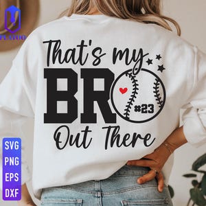 May include: White sweatshirt featuring the text "That's my BR Out There" in black. A baseball graphic with a red heart and the number 23 is on the right. The sweatshirt also has stars.