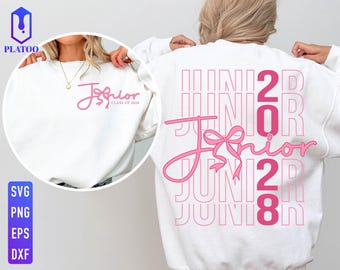 May include: A white crewneck sweatshirt featuring pink graphic text. The back displays the word JUNIOR in large outlined letters with the word Junior in cursive script and a bow graphic. The front chest shows the same cursive text and bow.