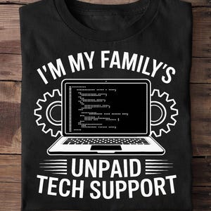 May include: Black t-shirt with the text "I'M MY FAMILY'S UNPAID TECH SUPPORT" in white. The design includes a laptop with code on the screen and gear-shaped elements. A humorous graphic tee for tech enthusiasts.