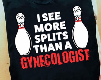 May include: Black t-shirt with a white graphic of two bowling pins and the text "I see more splits than a gynecologist".
