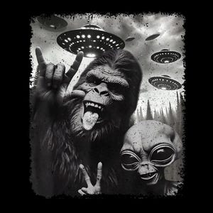 May include: Black and white graphic featuring a gorilla and an alien making hand gestures with flying saucers in the background. The gorilla is sticking out its tongue. The alien has large eyes and a smile. The image has a distressed, vintage look.