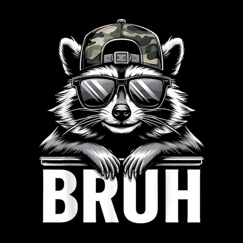 May include: A black and white illustration of a raccoon wearing sunglasses and a camouflage baseball cap. The raccoon is smiling and the word "BRUH" is written in white block letters below it.