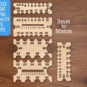 May include: Wooden gauge tools with measurements from 3mm to 50mm. The tools have cut-out notches and printed numbers. Text on the image includes "CUT FILES SVG, DXF, PDF, PNG, HIGH QUALITY FILES 300 DPI" and "Doodles Doodles Studio."