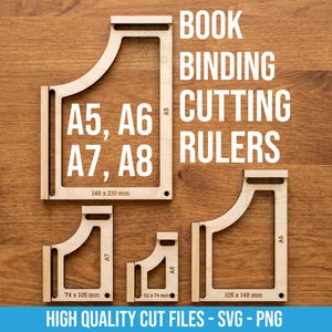 May include: Four light-colored wooden book binding cutting rulers in A5, A6, A7, and A8 sizes. The rulers feature cutouts and printed dimensions including 148 x 210 mm, 105 x 148 mm, 74 x 105 mm, and 52 x 74 mm. Text reads BOOK BINDING CUTTING RULERS.