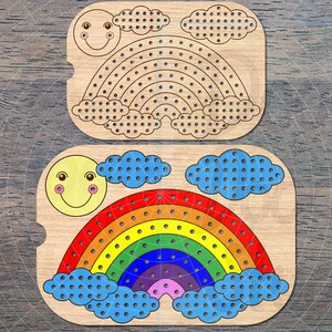 May include: Wooden rainbow pegboard set with a smiling sun and clouds. The rainbow is in shades of red, orange, yellow, green, blue, indigo, and violet. The set includes a blank pegboard and a colorfully painted one.