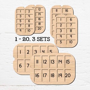Könnte beinhalten: Lernsets mit Holznummern, jeweils mit den Zahlen 1-20, in hellbrauner Farbe. Der Text "1 - 20, 3 SETS" wird angezeigt. Das Produkt stammt von Doodles Doodles Studio.