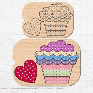May include: Two wooden pegboard puzzles featuring cupcake and heart designs. One puzzle is outlined in black, while the other is colorful with pink, green, blue, and purple layers. The puzzles have small holes for pegs.